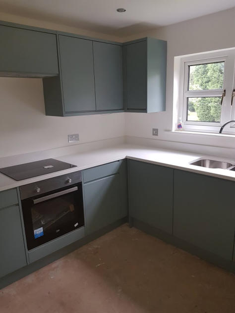 Fjord blue painted kitchen and white quartz worktops