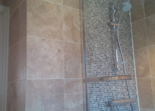 Travertine tiled bathroom